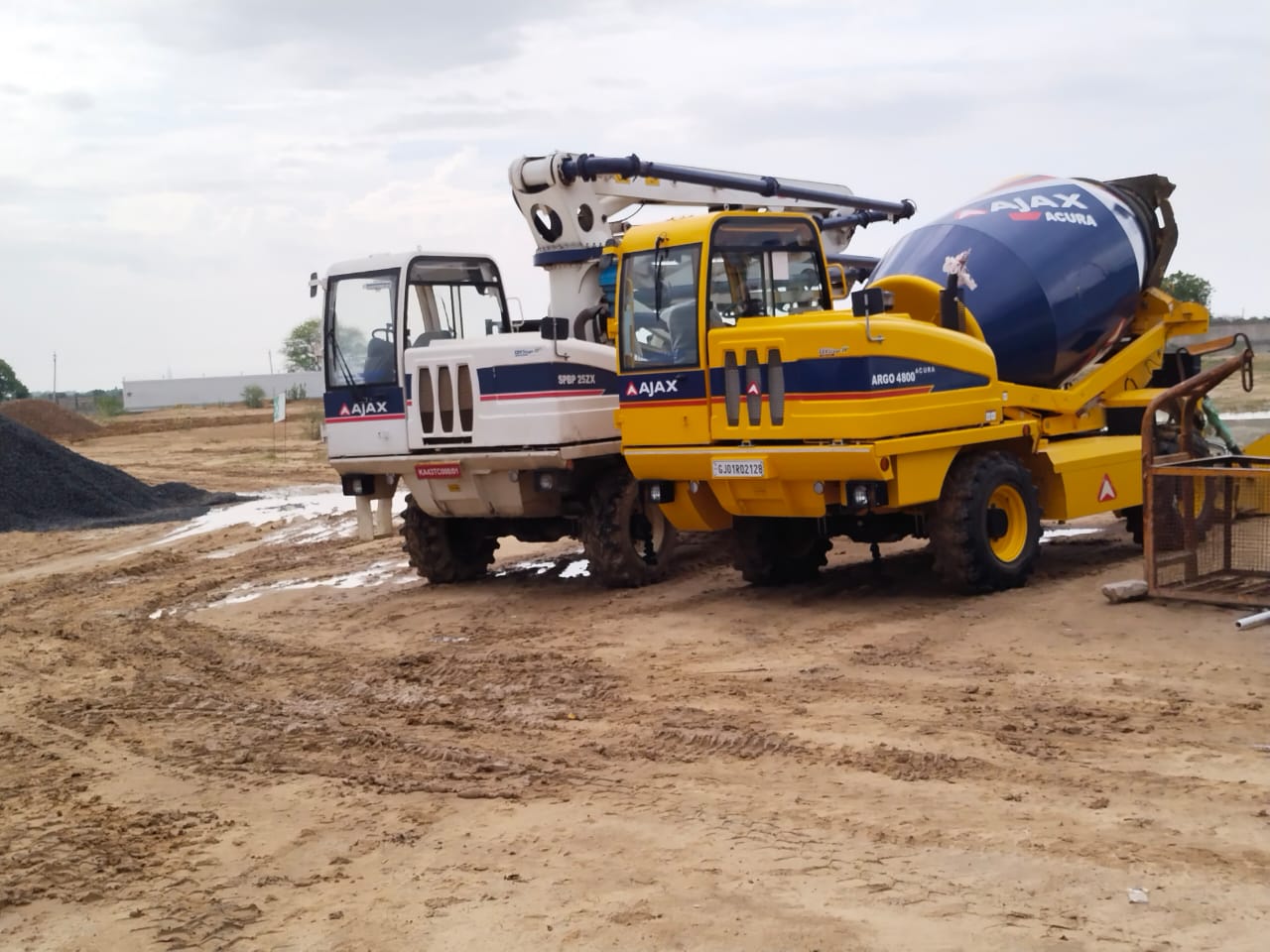 Concrete boom pump and self-loading concrete mixer